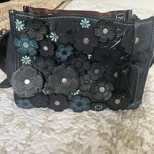 Coach tea rose rogue bag